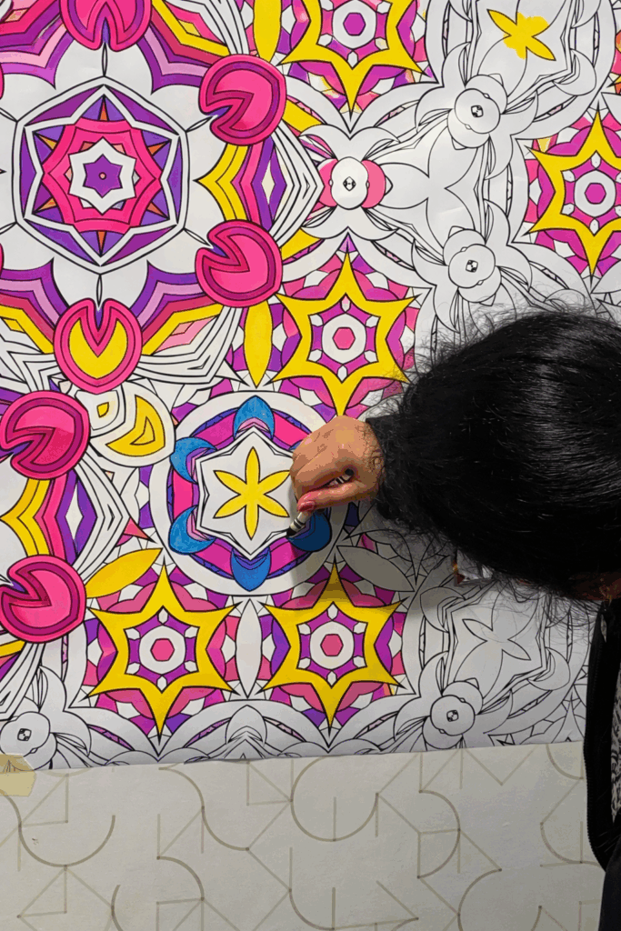 Woman coloring a mandala design in a sensory room